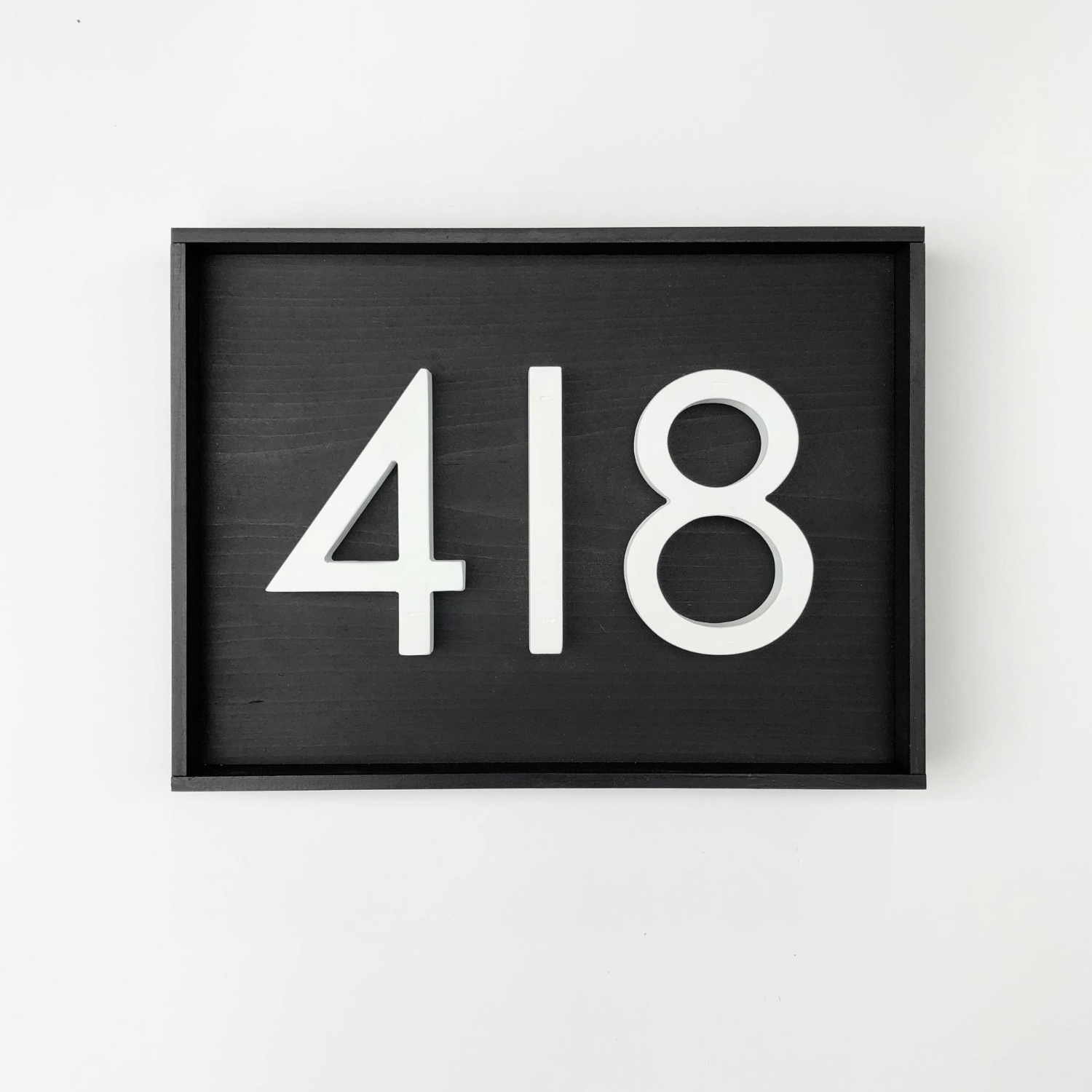 Wood address sign with black base with 3 modern white PVC numbers