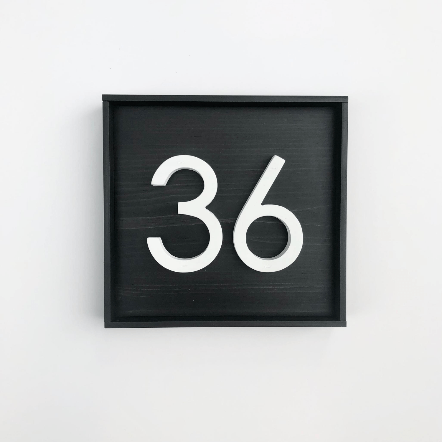 Square wood address sign with black base with 2 modern white PVC numbers