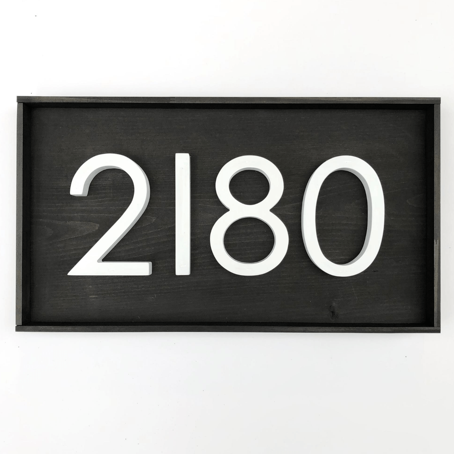 Horizontal wood address sign with black base with 4 modern white PVC numbers